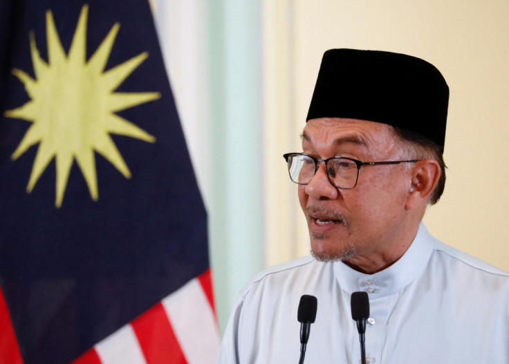 Malaysia's Prime Minister Anwar Ibrahim speaks during a news conference to announce his cabinet at Putrajaya