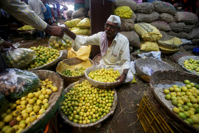 A vendor sells lemons at a wholesale market in Mumbai