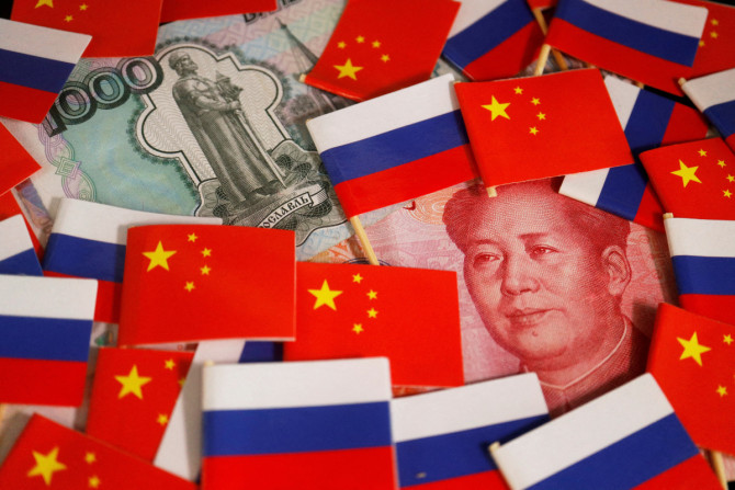 Illustration picture of China's yuan and Russia's rouble banknotes