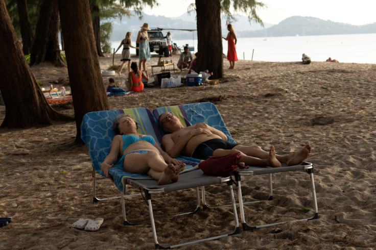 Russian tourists take a nap at Layan beach in Phuke