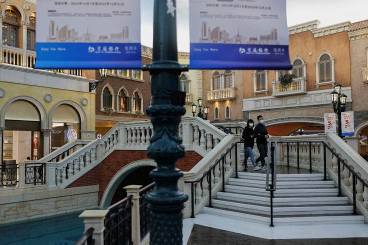 People wearing face mask walk inside the shopping mall of the Venetian Macao hotel and casino operated by Sands China during the coronavirus disease (COVID-19) pandemic in Macau
