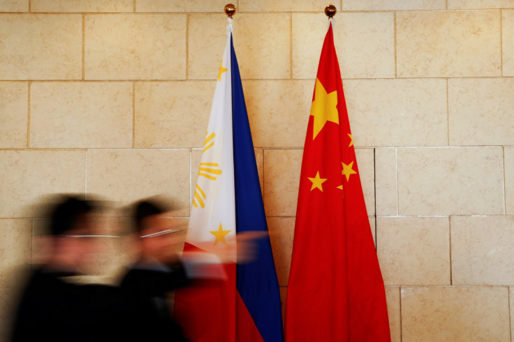 National flags are placed outside a room where Philippine Finance Secretary Carlos Dominguez and China's Commerce Minister Gao Hucheng address reporters after their meeting in Beijing