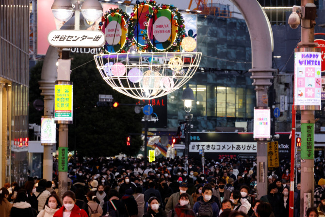 People make their way at a shopping district in Tokyo