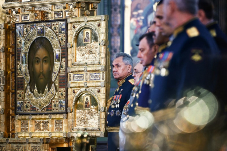 Russian Defence Minister Sergei Shoigu, centre, at a military cathedral near Moscow