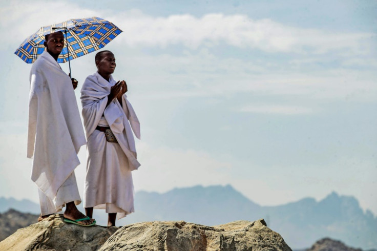 Muslim pilgrims pray on Mount Arafat, also known as Jabal al-Rahma (Mount of Mercy), southeast of the holy city of Mecca, during the climax of the Hajj pilgrimage, on July 8, 2022