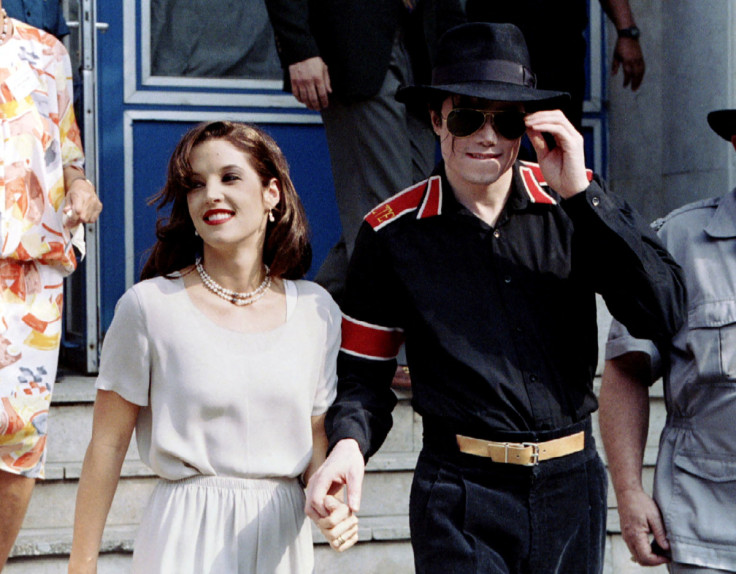 Popstar Michael Jackson and his bride Lisa Marie Presley-Jackson hold each others hands in Budapest
