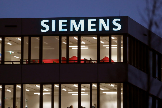 The logo of German industrial group Siemens is seen in Zug