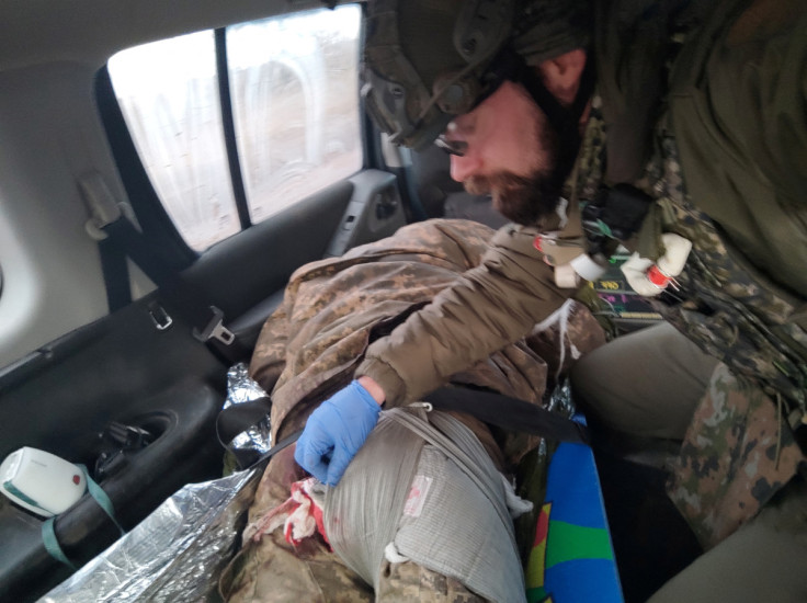 Damian Duda, a Polish paramedic who works in a team evacuating injured from Soledar and neighbouring areas, is seen in this handout picture taken in Soledar