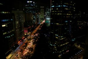 Buildings are seen as vehicles pass through the financial district of Makati city, metro Manila
