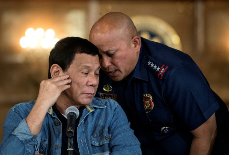 Former president Rodrigo Duterte (L) launched the anti-drug campaign in 2016, and pulled his country out of the ICC in 2019