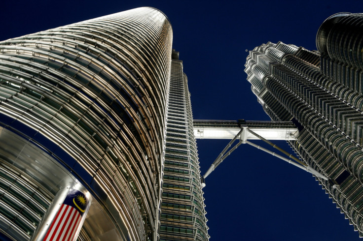 Malaysia's flag is seen at the landmark Petronas Twin Towers in Kuala Lumpur