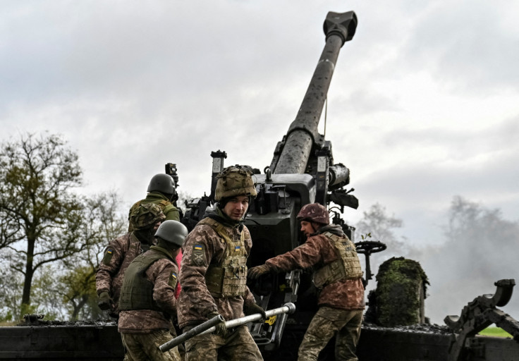 Ukrainian service members fire a shell from a towed howitzer FH-70 at a front line in Zaporizhzhia Region