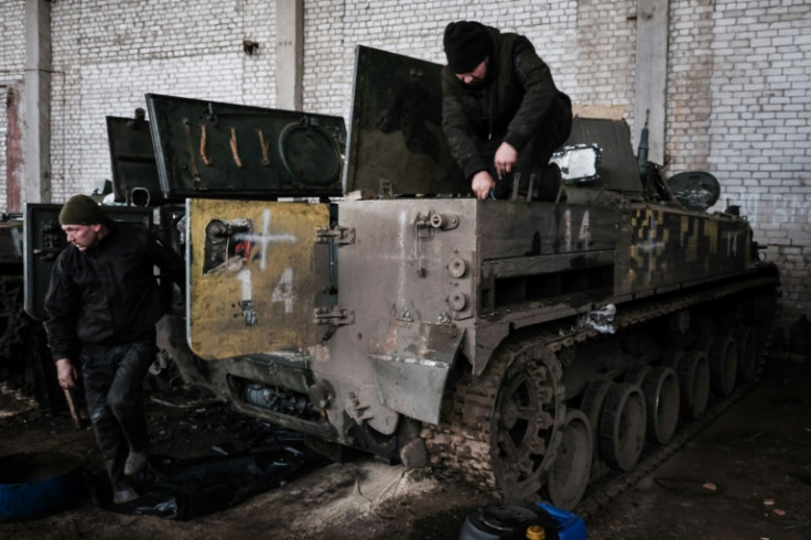 Mechanics from the Ukrainian Army's 14th Mechanised Brigade refurbish captured Russian armoured vehicles