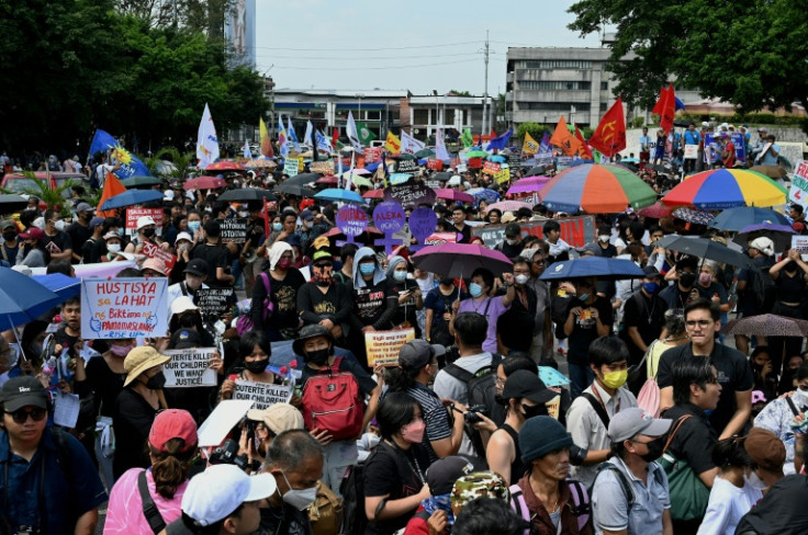Protesters mark the anniversary of the 1986 'People Power' revolution that ousted dictator Ferdianand Marcos Sr