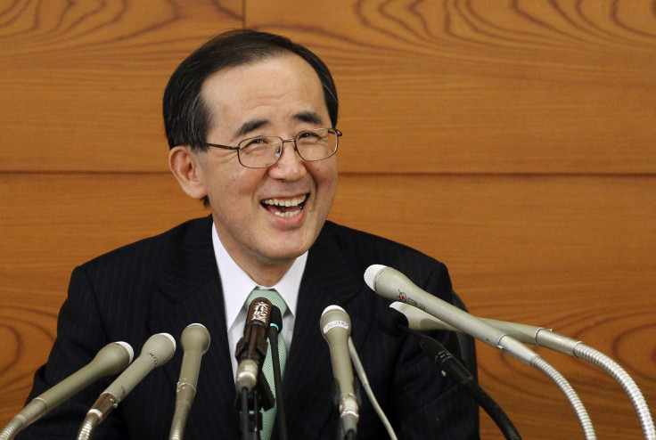 Outgoing Bank of Japan Governor Masaaki Shirakawa smiles during his last news conference as head of the central bank, in Tokyo