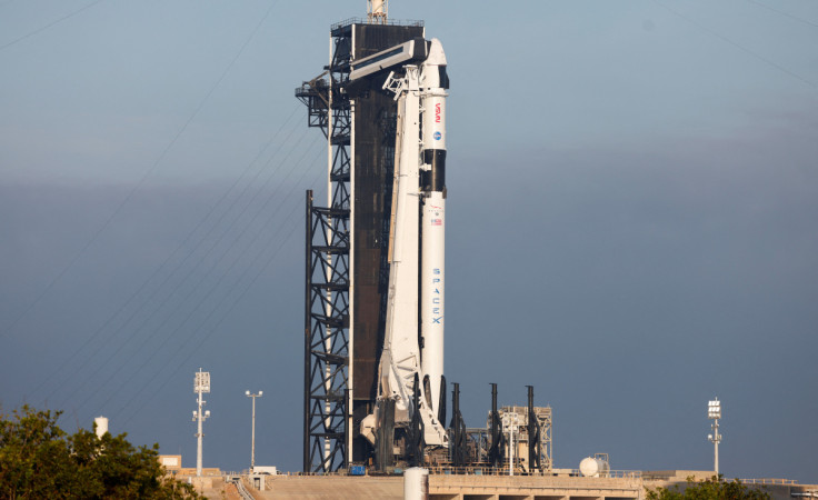 A Falcon 9 rocket is readied for flight after a delay for NASA's SpaceX Crew-6 mission in Cape Canaveral
