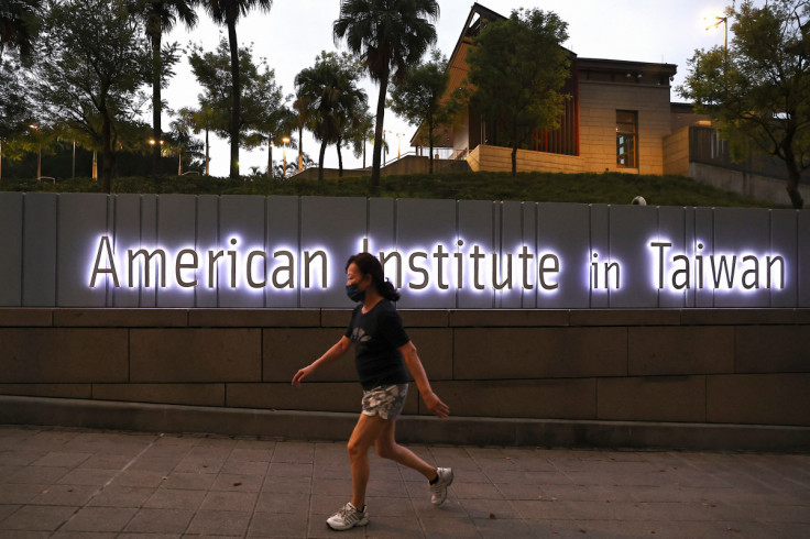 A woman walks past the American Institute of Taiwan in Taipei