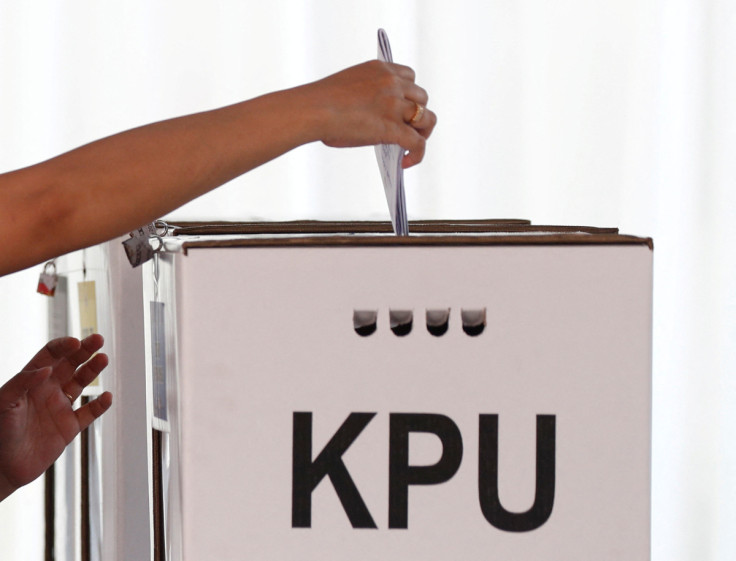 A voter casts a ballot during elections in Jakarta, Indonesia