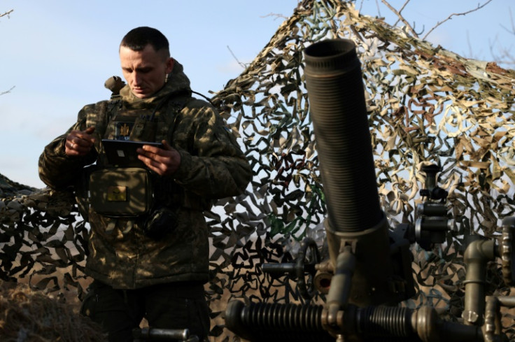 A Ukrainian soldier prepares to fire a French mortar towards Russian positions at a front line in the Donetsk region