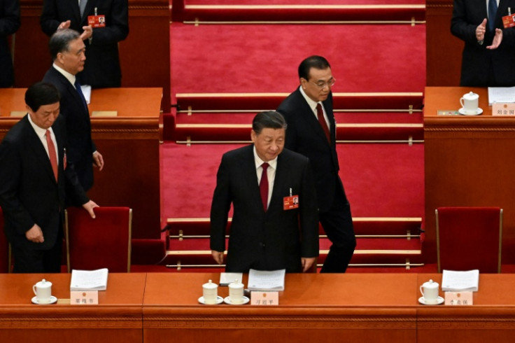 China's President Xi Jinping (centre L) and Premier Li Keqiang (centre R) arrive for the opening session of the National People's Congress (NPC) at the Great Hall of the People in Beijing on March 5, 2023.