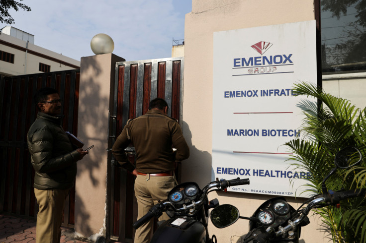 Police is seen at the gate of an office of Marion Biotech, a healthcare and pharmaceutical company and a part of the Emenox Group, whose cough syrup has been linked to the deaths of children in Uzbekistan, in Noida