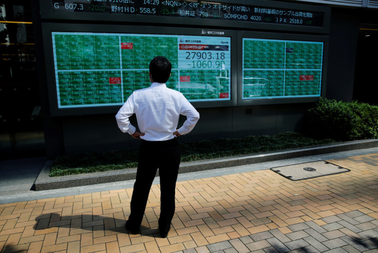 Asian stocks drop as Fed shift reverberates