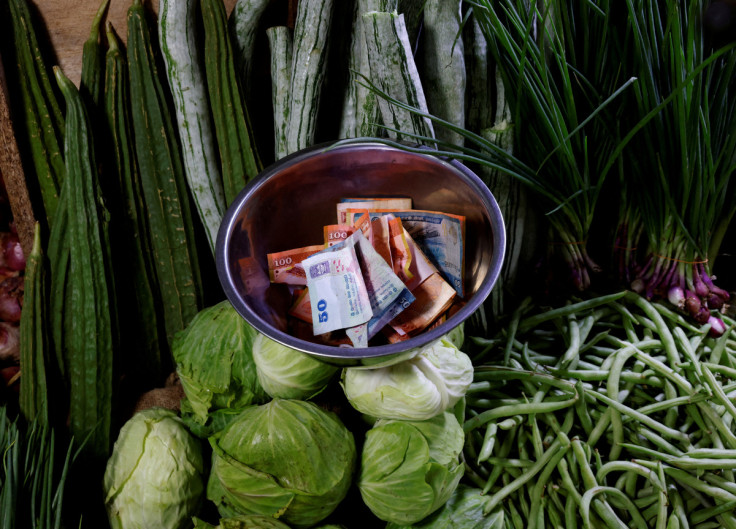 Sri Lankan rupees are seen in a bowl at a vegetable vendor's shop amid the rampant food inflation, amid Sri Lanka's economic crisis, in Colombo