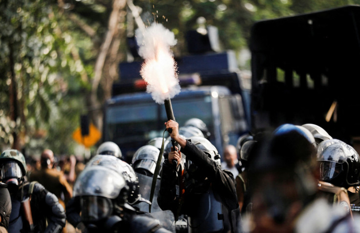 Police use water cannons to disperse Inter University Students' Federation members during a protest, in Colombo
