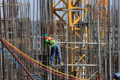 A worker installs steel rods at a construction site in Paranaque city, metro Manila, Philippines May 29, 2018. 