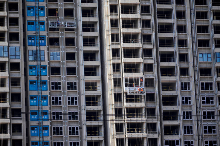Workers install windows for residential buildings under construction, following the coronavirus disease (COVID-19) outbreak, in Shanghai
