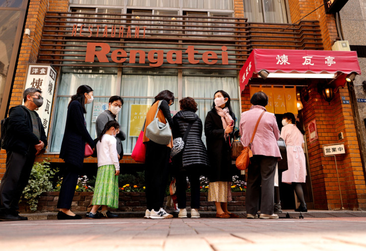 People form a line as they try to have lunch at Rengatei restaurant in Tokyo