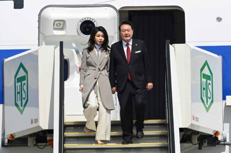 South Korean President Yoon Suk Yeol (R) arrives in Japan for a summit with Japanese counterpart Fumio Kishida