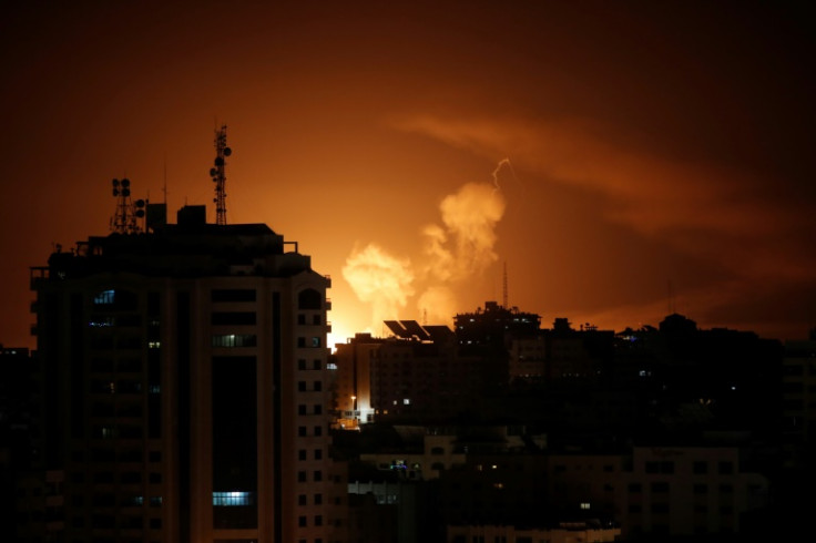 Smoke rises above buildings in Gaza City as Israel launches air strikes on the Palestinian enclave