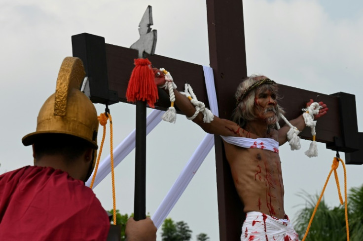 Filipino Christian Wilfredo Salvador is nailed to a cross during the re-enactment of the crucifixion of Jesus Christ on Good Friday