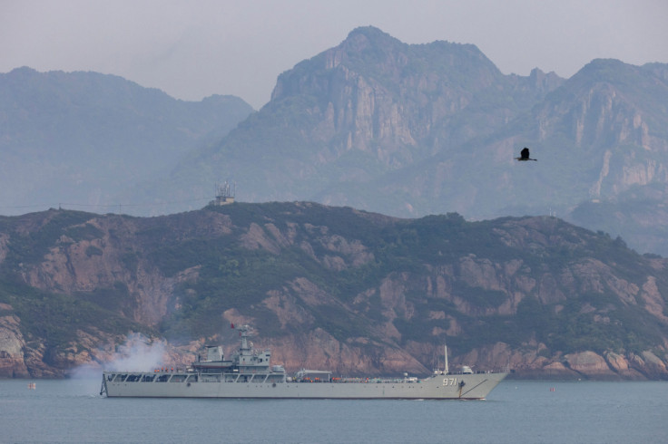 A Chinese warship fires during a military drill off the Chinese coast near Fuzhou, Fujian Province