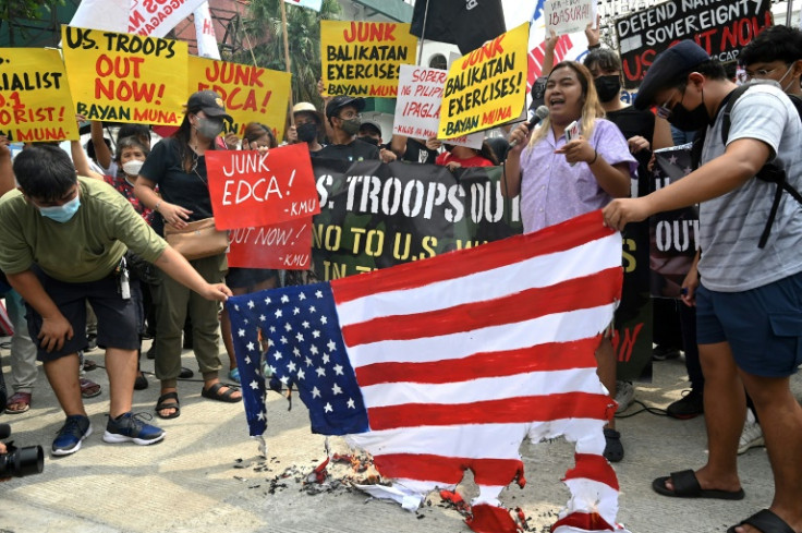A few dozen activists staged a protest calling on the Philippine government to scrap the joint military exercises