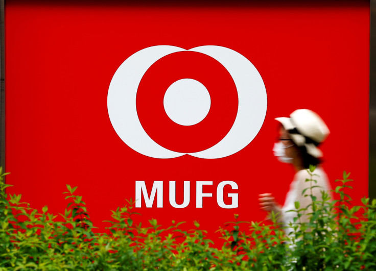 A woman walks past a branch of Mitsubishi UFJ Financial Group's bank of Tokyo-Mitsubishi UFJ (MUFG) in Tokyo