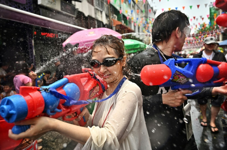 By midday the floral shirts on backpacker hotspot Khao San Road were already drenched, the beers cracked, and the music blasting