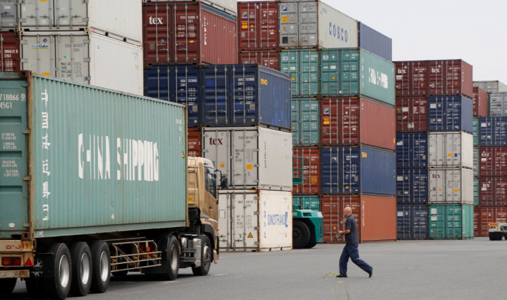 A laborer works in a container area at a port in Tokyo