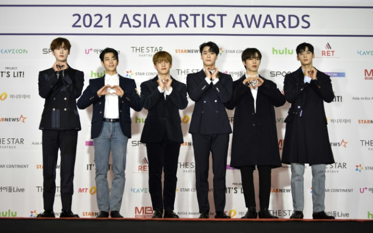 K-pop star Moobin (3rd from right), seen here with his band Astro in 2021, has died at the age of 25