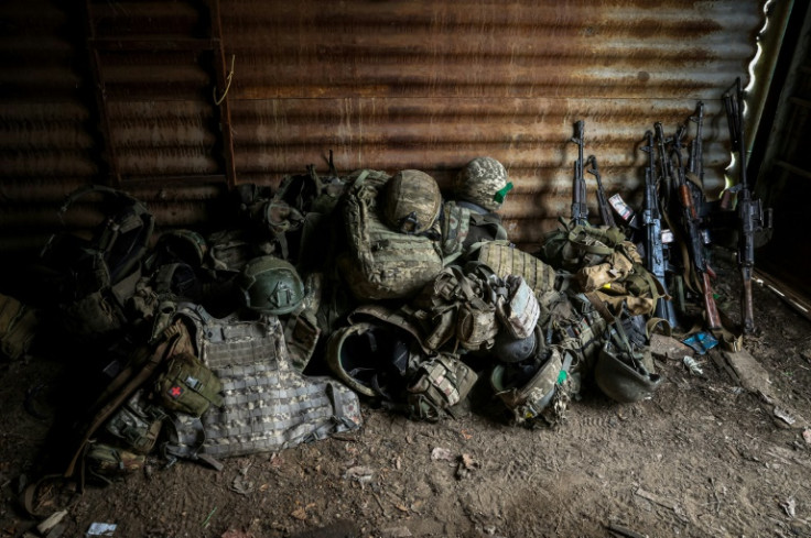 Military equipment removed from wounded Ukrainian servicemen, at a frontline medical point near the embattled city of Bakhmut