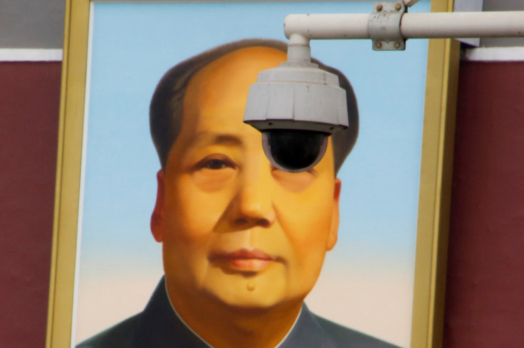 Security camera overlooks Tiananmen Square in front of a portrait of Mao in Beijing