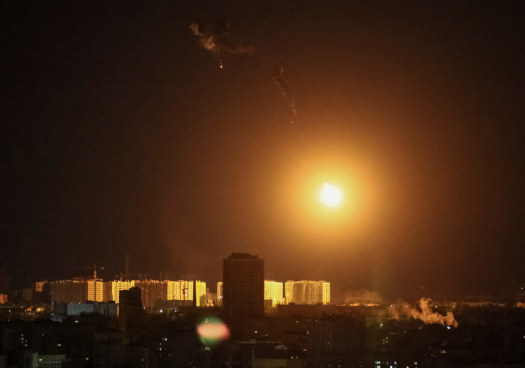 An explosion of a drone is seen in the sky over the city during a Russian drone strike in Kyiv