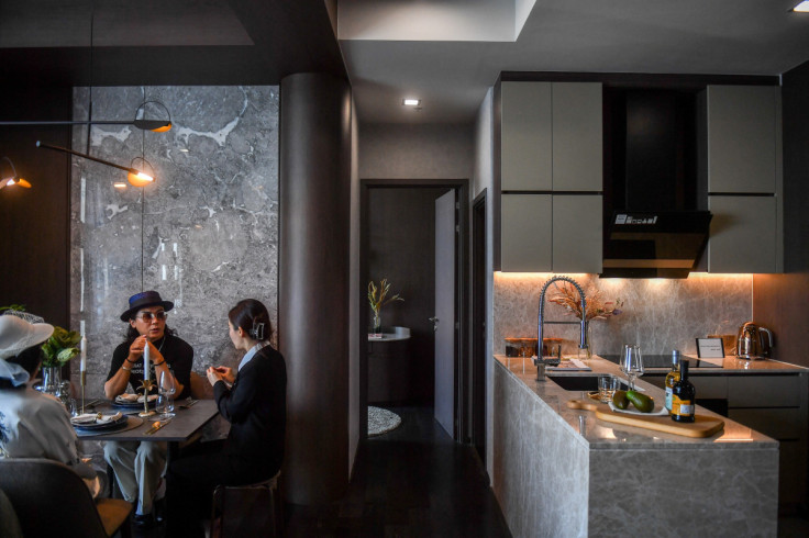 Daniel Bian, a Chinese potential property buyer from Shanghai, visits a luxury condominium in Bangkok