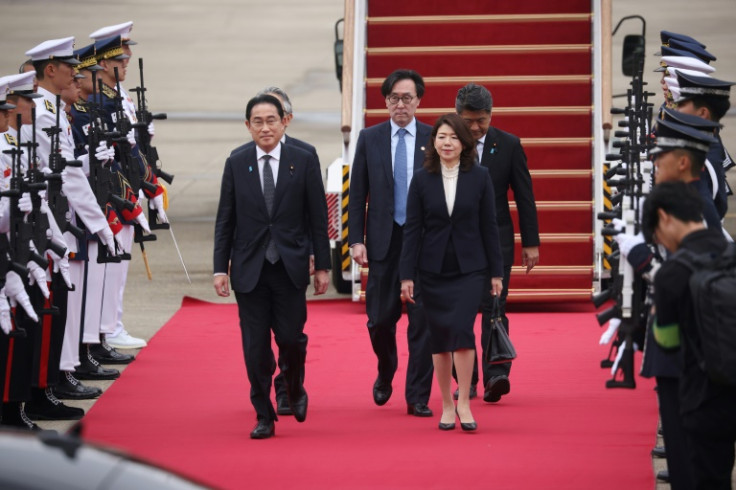 Japanese Prime Minister Fumio Kishida (L) arrived in South Korea on Sunday as Seoul and Tokyo seek to mend ties in the face of nuclear threats from Pyongyang