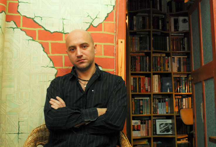 Russian writer Zakhar Prilepin poses for a picture in his flat in Nizhny Novgorod