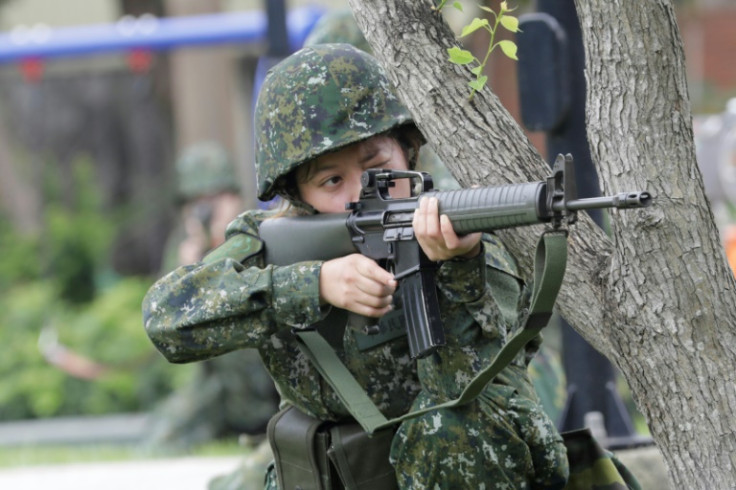 A woman reservist takes part in a defence training drill in Taoyuan city, Taiwan