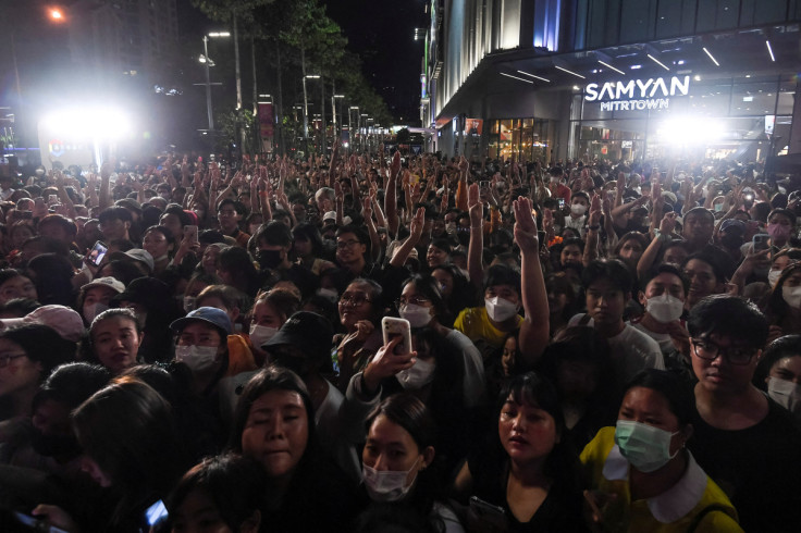 Move Forward Party supporters show the three-finger salute during an upcoming election campaign event in Bangkok