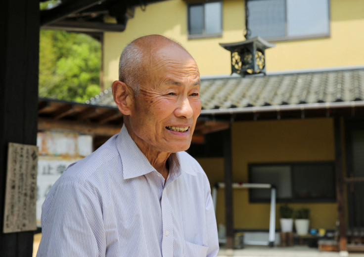 Atomic bomb survivor Toshiyuki Mimaki speaks during an interview with Reuters outside of his home in Yamagata district