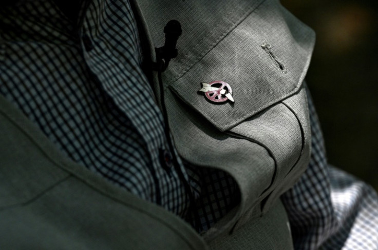 An anti-nuclear symbol is seen pinned on the jacket of atomic bomb survivor Masao Ito in Hiroshima